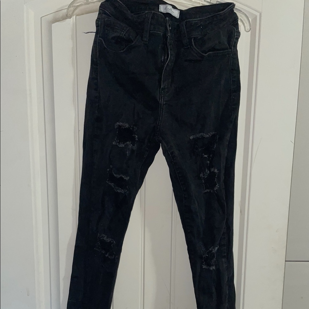 KanCan Black High-Rise destructed skinnies.
